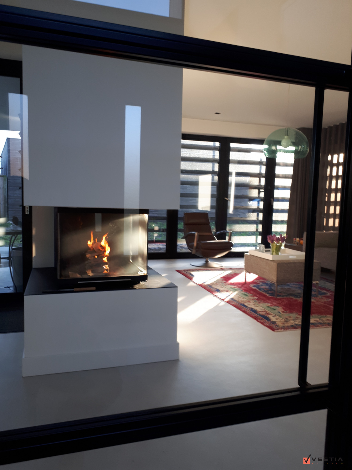 Liftdeurhaard roomdivider als eyecather in de living