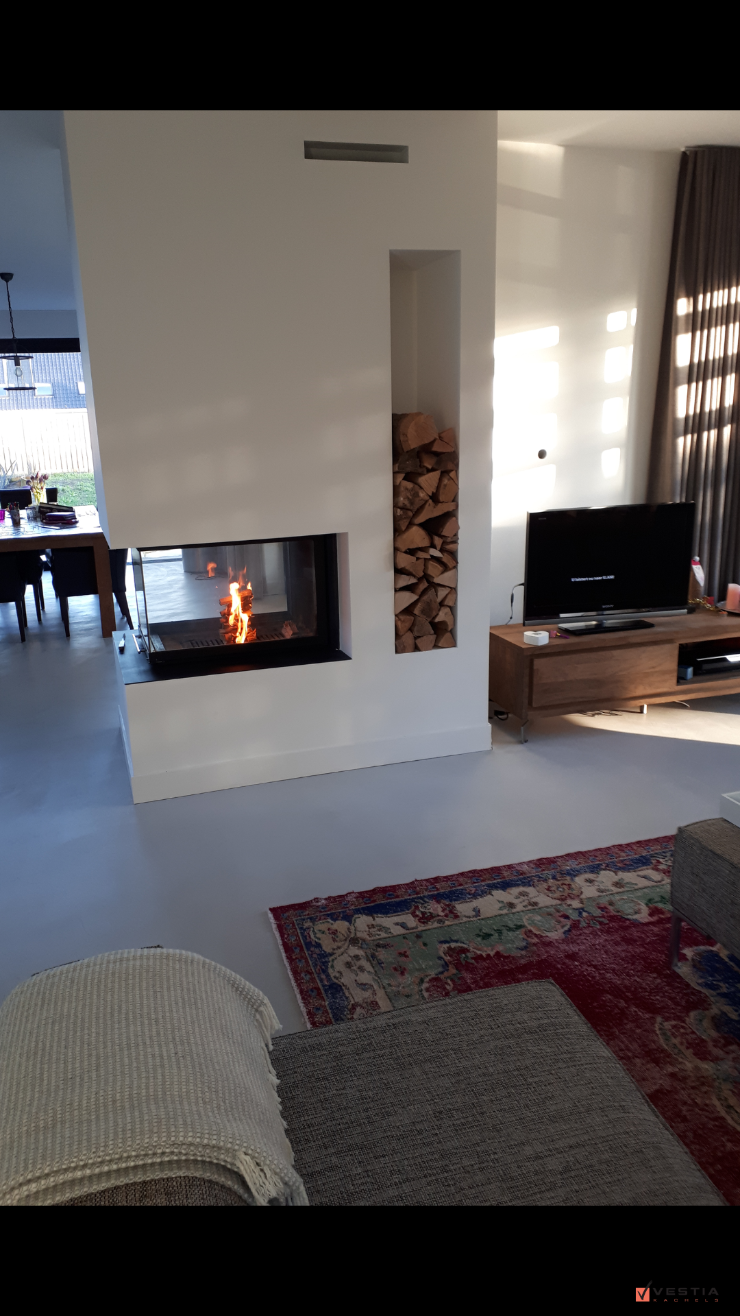 Liftdeurhaard roomdivider als eyecather in de living